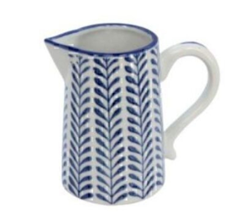 This small Blue & White Ceramic Leaf Jug by designer Gisela Graham would look lovely on the table in the morning with your milk in for tea or coffee. It matches the other items we have for sale - the mug and bowl. Perfect for a shabby chic home this blue and white ceramic jug would be at home either on display or being used every day. Made from Ceramic. Size: (LxWxD) 115x85x13cm